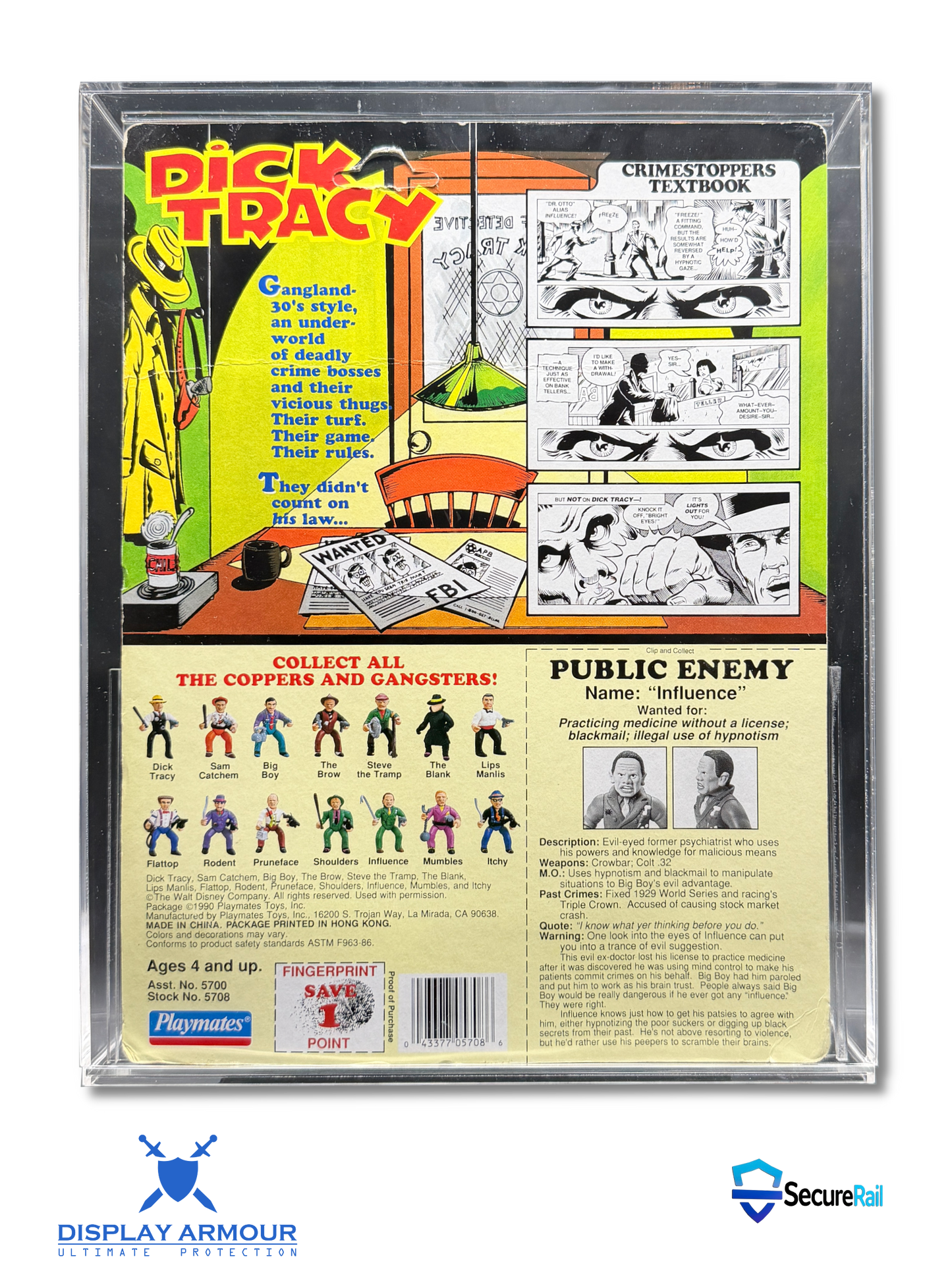 Back of a Dick Tracy collectible toy package inside a clear plastic display case, showing comic book panels, character figures, and printed product information on a white background.