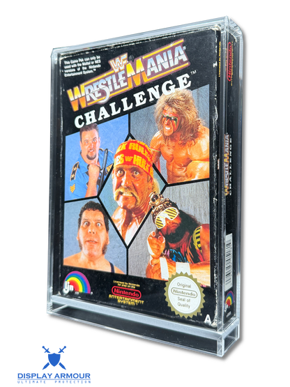 A clear plastic display case holding a vintage Nintendo NES game cartridge for WrestleMania Challenge. The cartridge cover features multiple color images of wrestlers, including Randy Savage and Bret Hart, with the WrestleMania logo at the top.